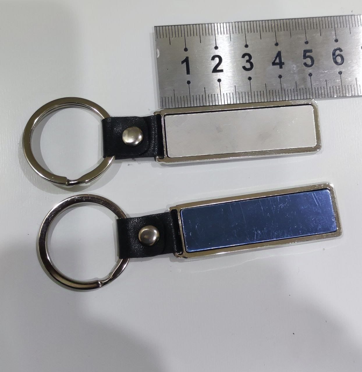 مداليات مفاتيح بليت المنيوم